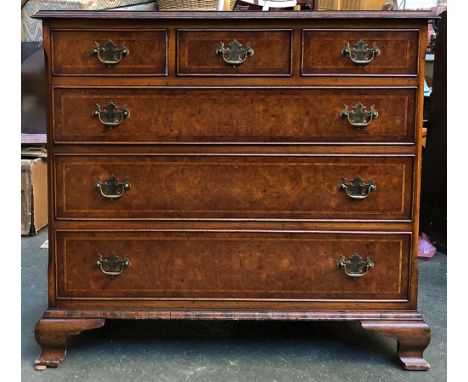 A reproduction burr walnut veneer chest of three short over three long drawers, on ogee bracket feet, 93x52x85cmH 