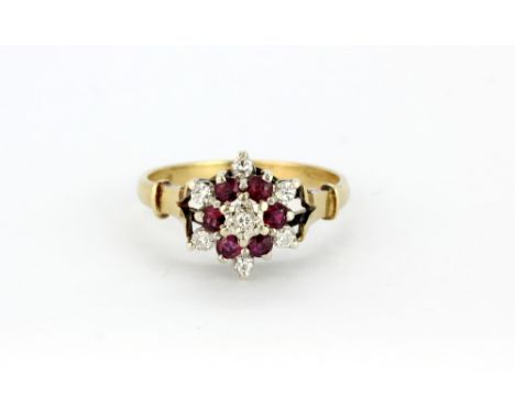 A 9ct yellow gold ruby and diamond set cluster ring, (R).