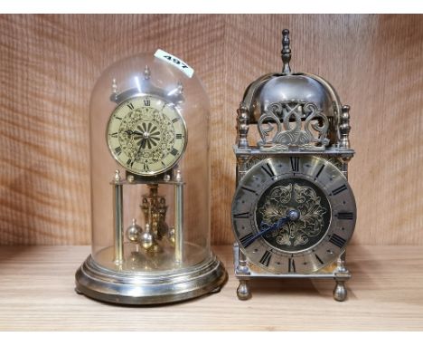 A Smiths brass lantern clock with original mains electric movement (currently not wired) together with a Kundo torsion pendul