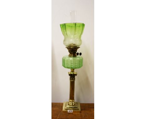 A large antique brass Corinthian column banqueting oil lamp with green glass fount and etched green glass shade, overall H. 7