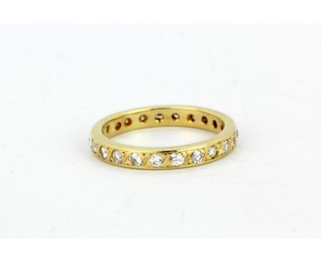 A 14ct yellow gold (stamped 585) diamond set full eternity ring, (K.5).