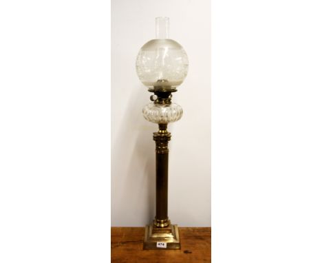 An impressive large antique Corinthian column brass oil lamp with etched glass shade, overall H. 89cm.