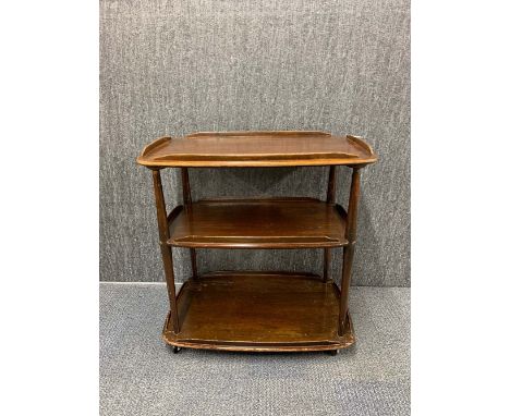 An Ercol type oak three tier trolley, W. 71cm.