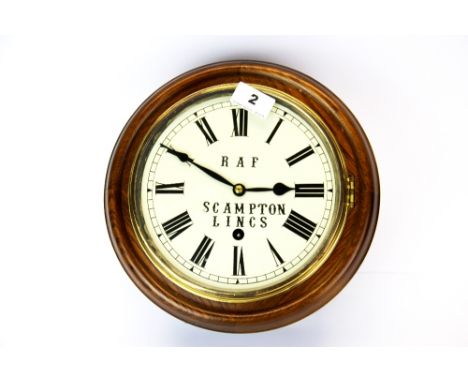 An oak wall clock, Dia. 27cm. (no pendulum).
