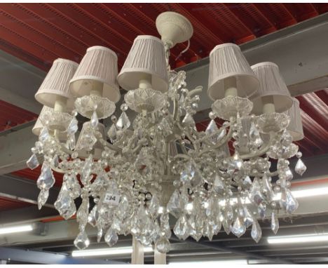A large twelve branch metal and crystal drop chandelier light fitting, Dia. 82cm, D. 76cm.