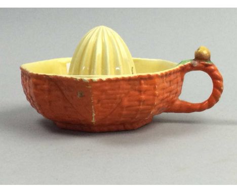 GROUP OF CARLTON WARE LEAF MOULDED TEA CHINA,along with a lemon squeezer and an oval ashet by George Logan