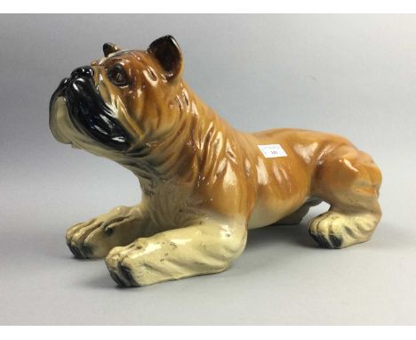 LARGE CERAMIC FIGURE OF A BULLDOG,52cm long, along with various other animal figures, predominantly dogs, also including a pa
