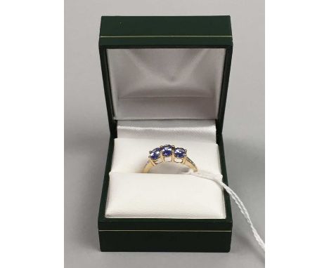 TANZANITE THREE STONE RING,in ten carat gold, approx 2.0gCondition report: The stones appear to be in good condition with no 