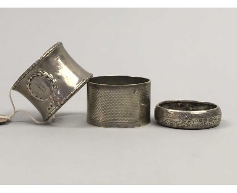 SILVER NAPKIN RING,Birmingham marks, with initial 'D' in a luarel leaf design, along with another silver napkin ring and a pl