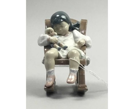 LARGE NAO FIGURE GROUP OF A SAILOR AND BOY,31cm high, along with a Lladro figure of a sleeping girl on rocking chair (2)Condi