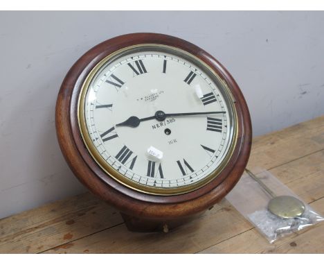 A Railway Clock, the mahogany circular case, with white enamel dial, with Roman numerals inscribed F.W. Elliott Ltd, England 