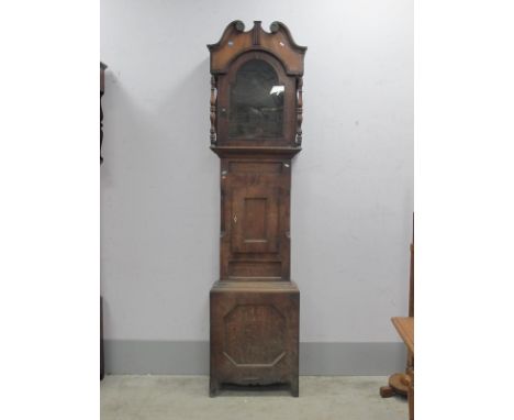 XIX Century Mahogany Clock Case, with a swan neck pediment, arched door, trunk with a small door, on bracket feet, 239cm.