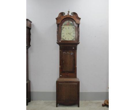 XIX Century Mahogany Oak Eight Day White Dial (C. Clark Wakefield) Longcase Clock, with a swan neck pediment, arched door, tr