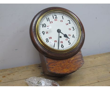An Early XX Century Oak Cased Railway Style Clock, the white enamel dial with Arabic numerals 1-12 in black and 13-00 in red,