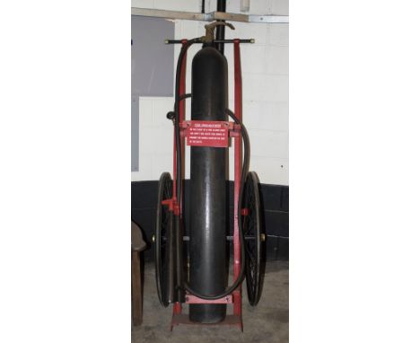 Fire Appliance - A large early 20thC Trolley-mounted Fire-Extinguisher c1920; comprising a large pre-pressurized cylinder-res
