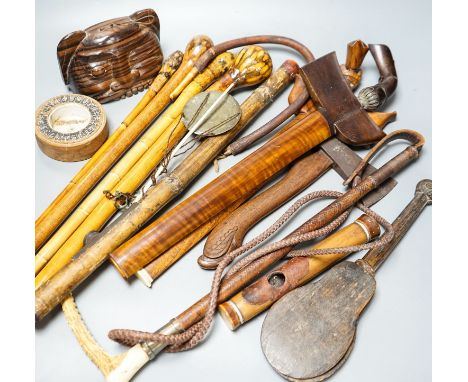 Two Eastern kris, an opium pipe, sticks, busts, etc.