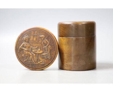 A French press moulded burr wood snuff box of circular form, decorated in semi-relief to the top with a scene entitled 'Nicol