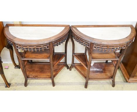 A pair of Chinese marble-topped demi lune console tables, width 82cm, depth 40cm, height 80cm