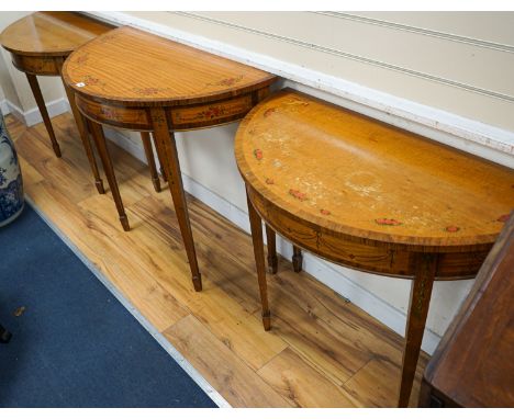 Three Sheraton style painted satinwood demi lune console tables, largest 92cm, width 46cm, height 82cm