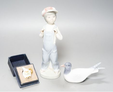 A Lladro figure of a young boy, 21.5cm high, a Royal Copenhagen model a tern, a cased miniature Royal Worcester jug, signed N