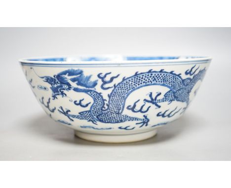 A Chinese blue and white ‘dragon’ bowl, Kangxi mark, late 19th century25cm