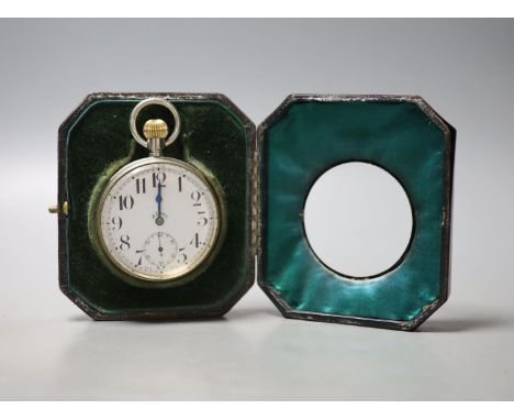 A George V engine turned silver mounted travelling watch case, with nickel cased 8 day pocket watch, 11.6cm.