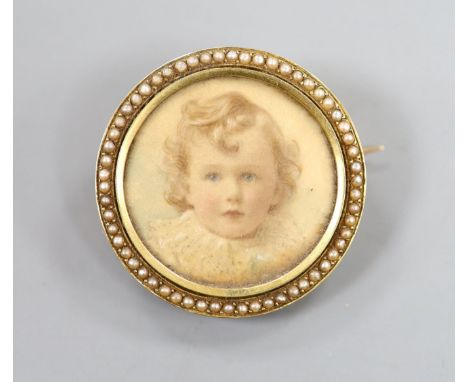 An early 20th century yellow metal and split pearl set circular brooch, inset with portrait of a young, verso with hair benea