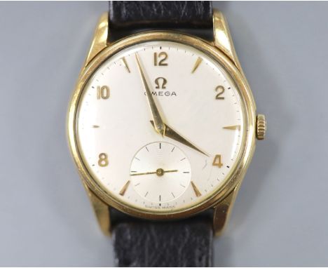 A gentleman's 9ct gold Omega manual wind wrist watch, on associated leahet strap, with case back inscription, case diameter 3