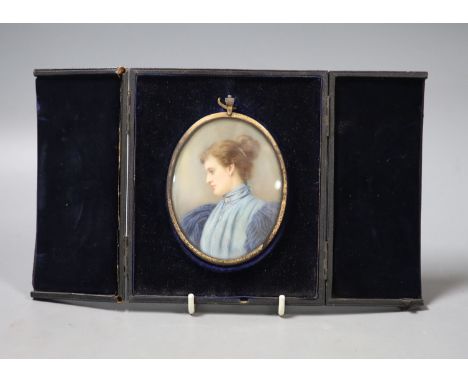 A late Victorian cased oval miniature on ivory, signed Elliott &amp; Fry, portrait of a young woman wearing a blue dress, wit