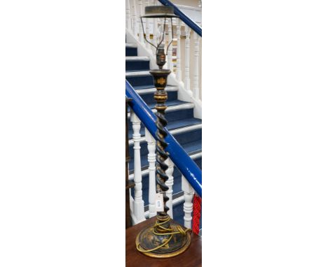 An early 20th century tall black-lacquered and gilt chinoiserie-decorated candlestick, having spiral-twist column (now conver