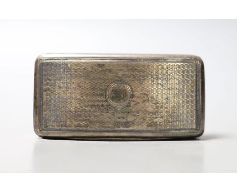 A George III engine turned silver concave snuff box, William Eaton, London, 1814, 79mm.