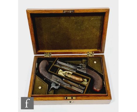 A cased pair of travelling pistols by Anderson London, 7.5cm octagonal barrels, leaf engraved actions, chequered butts with a