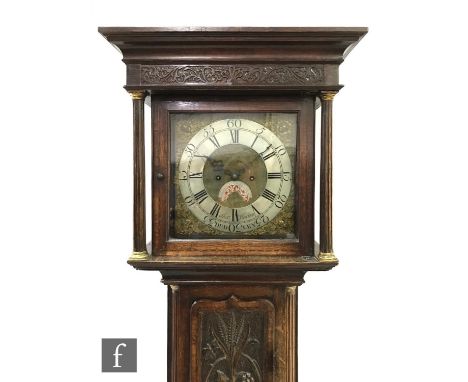 An 18th Century and later oak and mahogany cross-banded longcase clock with an eight-day movement striking on a bell, the hoo