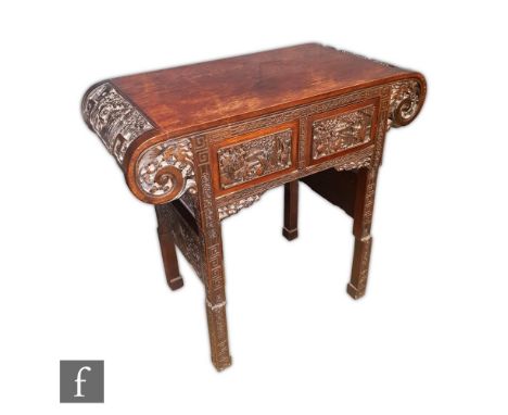 A Chinese Huanghuali style altar table, the yoke form supports rising to a twin plank top with scroll ends, with two fitted d