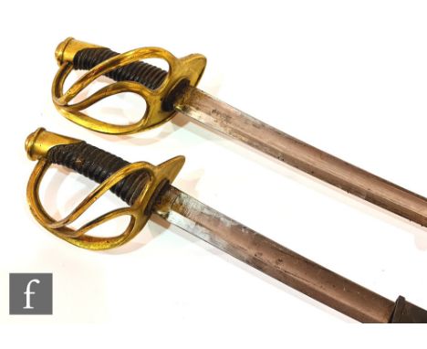 A pair of officer's sabres and scabbard, leather wire grip, open brass hilts, unmarked, blades 89cm. (2) 