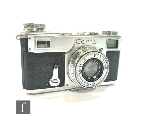 A Zeiss Ikon Contax II 35mm rangefinder camera, serial number B31005, together with a Carl Zeiss 1:2, 8.5cm lens, serial numb