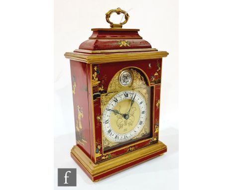 A late 20th Century George III style bracket clock in a red chinoserie lacquered case, fixed key, height 29cm. 