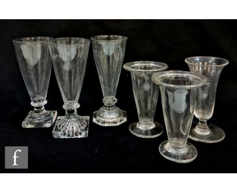 A group of 18th Century and later glasses to include three ale glasses with various adaptations of a lemon squeezer foot bene