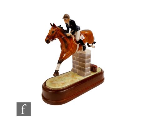 A Royal Worcester equestrian figure of Stroller and Marion Coakes, modelled by Doris Lindner, printed mark, retains wooden pl