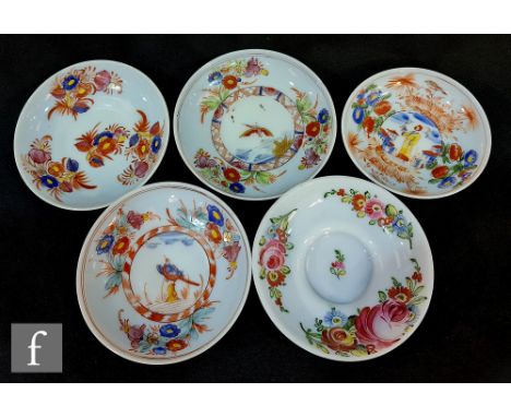 A group of five 18th Century continental Milchglas or opal glass saucers hand painted in the Chinese taste with landscape, fi