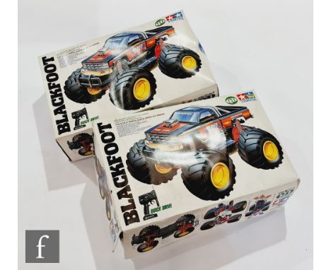 Two Tamiya Blackfoot 1:14 scale Quick Drive Cars, both boxed. (2) 
