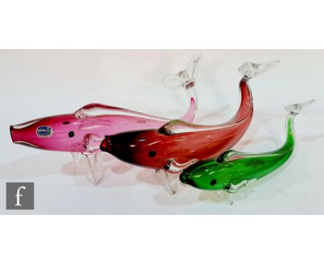 A 20th century Czechoslovakian glass fish with a pink hollow body and applied clear glass fins, retains original label, toget
