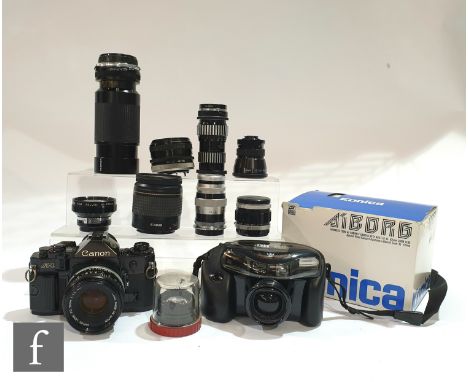 A collection of Canon, Tamron and Konica cameras and lenses, to include a Canon A-1 SLR camera, with FD 50mm 1:1.8 lens, a Ko