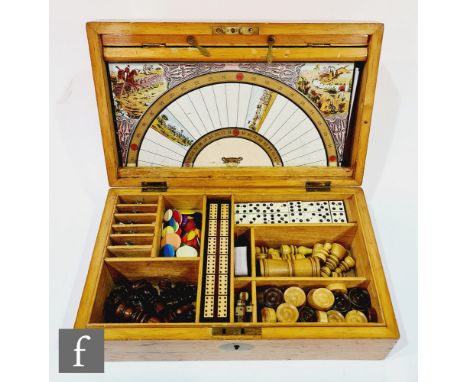 An early 20th Century walnut cased games compendium, fitted with a divisioned interior containing a cribbage board, chess, dr