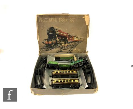 A Mettoy Passenger Train Set, comprising a 4-4-0 green Eton tinplate clockwork locomotive and tender, two Pullman coaches and
