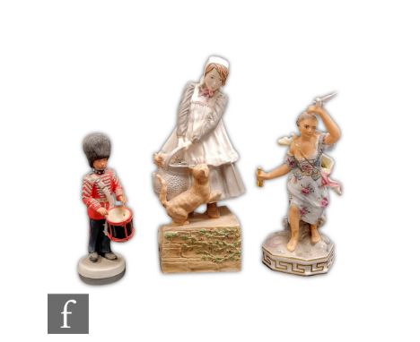 Three assorted figurines comprising a Wedgwood The Drummers Foot Guard, a Royal Worcester Upstairs Downstairs The Scullery Ma