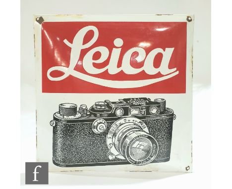A vintage enamel Leica camera advertising sign, possibly 1930s/40s, the convex curved sign with vibrant red text and black an