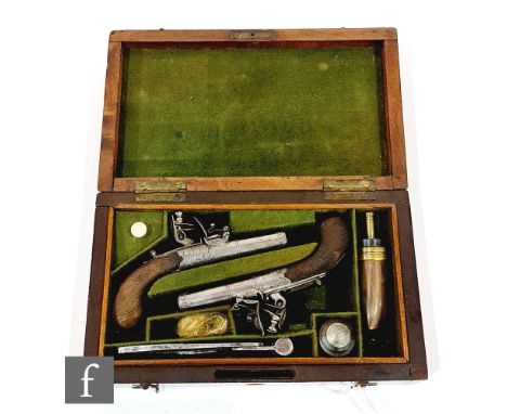 A cased pair of early 19th Century flintlock pocket pistols by H Nock London, engraved steel actions and twist off barrels, f