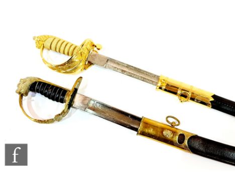 An Elizabeth II naval officer's dress sword by Crown swords London, engraved 80cm blade and part leather scabbard and a simil