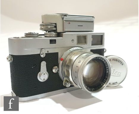 A Leica M2 rangefinder camera, circa 1960, serial number 982140, chrome body, with fitted M2 exposure meter, serial number 01